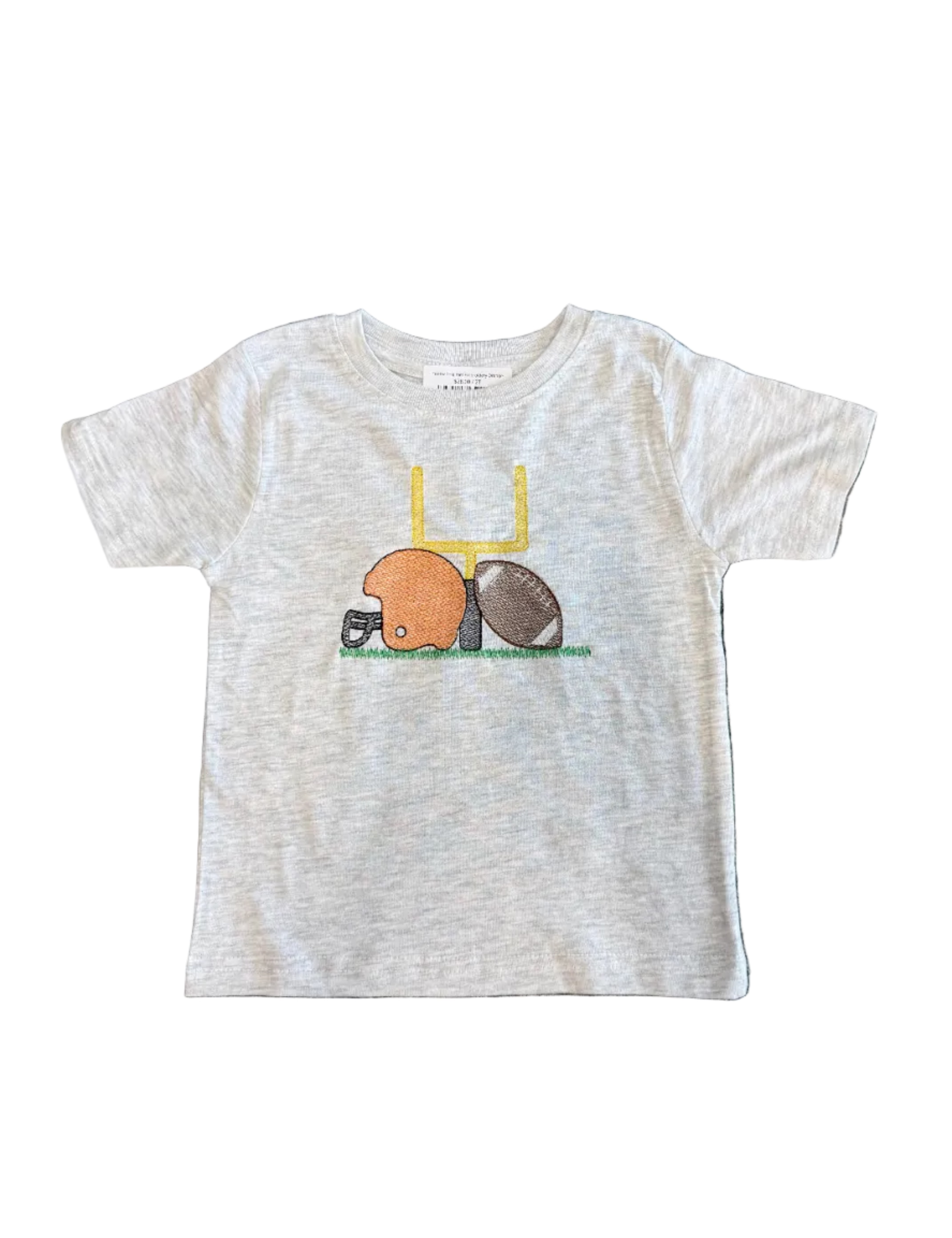A light heather gray baby t-shirt laid flat on a dark patterned rug. The shirt features a graphic of a yellow chair with a brown football and an orange duck wearing a football helmet.