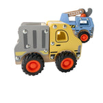 Toy construction vehicles including a bulldozer, truck, and crane on a white surface.