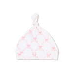 White baby hat with pink diamond pattern on a white background
