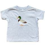 Gray t-shirt with a duck graphic on a textured surface