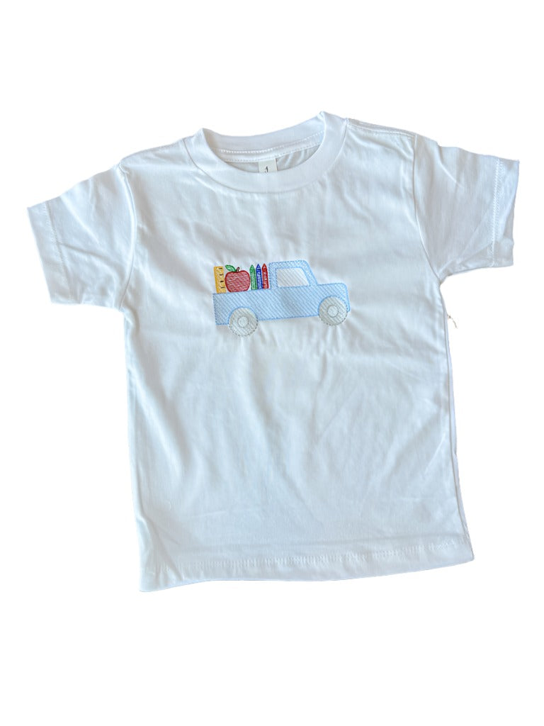 A white short-sleeved toddler t-shirt with a blue truck and school-related items embroidered on the front.
