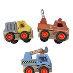 Three toy trucks on a white surface