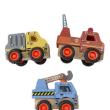 Three toy trucks on a white surface