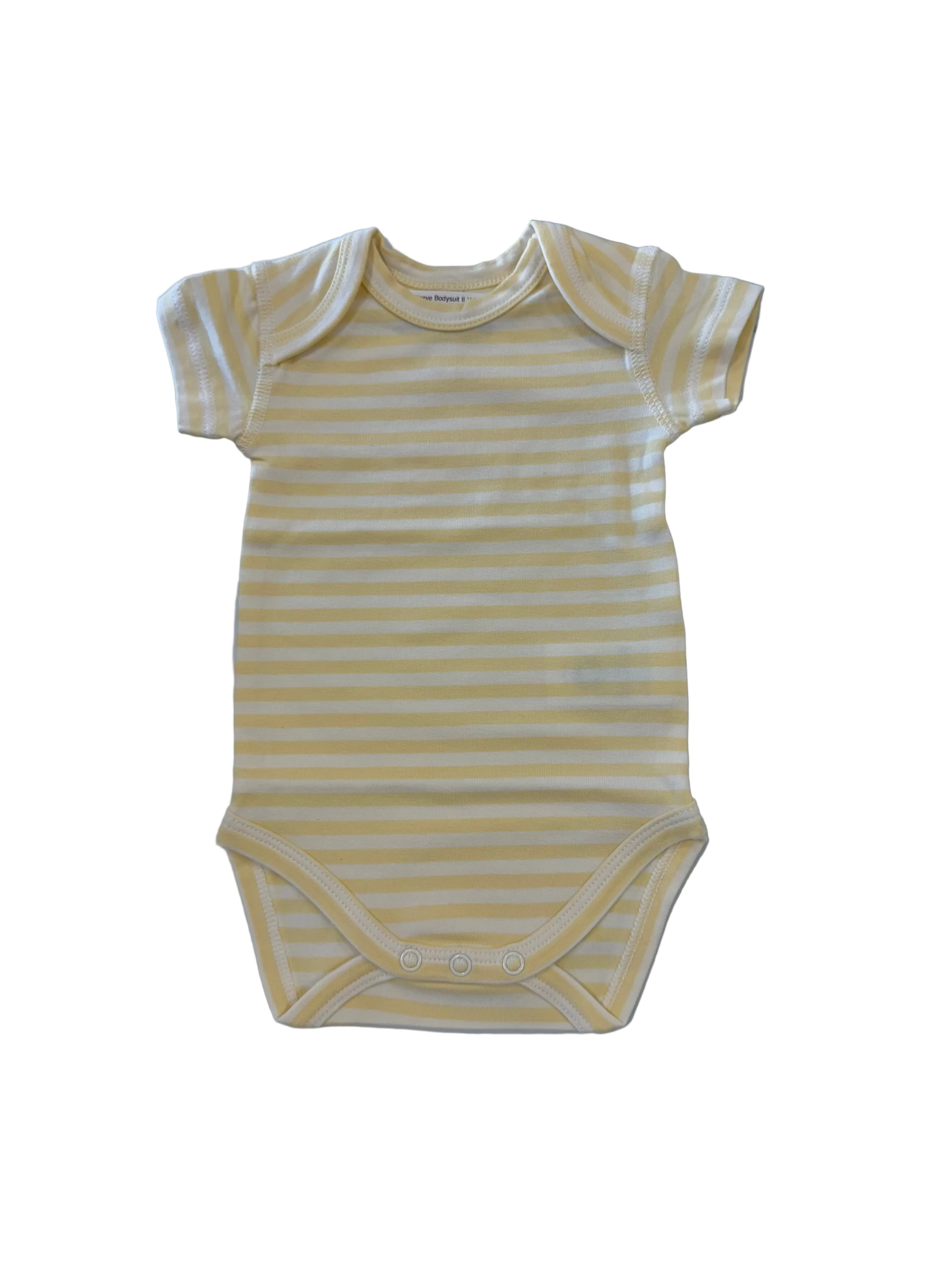 Yellow and white striped baby onesie on a marble surface